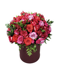 pink roses and lisianthuses in a box. USA